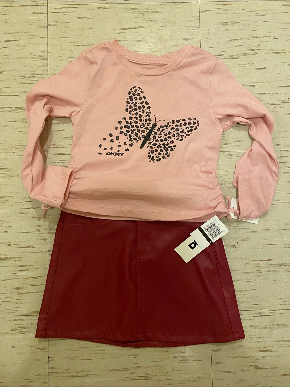 DKNY Pink Long-Sleeve Tee with Leopard Butterfly Print and leather skirt